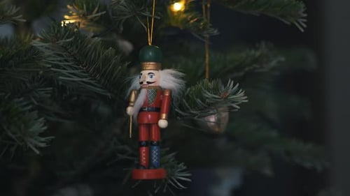 Nutcracker Soldier Toy on a Christmas Tree With Blurred Background Dolly 4K Shot.
