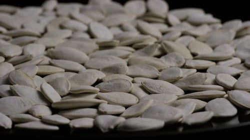Pile of Raw Pumpkin Seeds Rotating Close Up