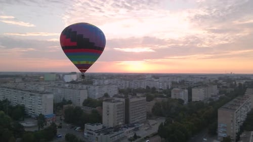 Colorful Hot Air Balloons Flying Over Green Park in Small European City at Summer Sunrise, Aerial