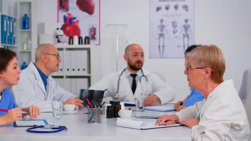 Medical Team Discussing X-Ray During a Meeting