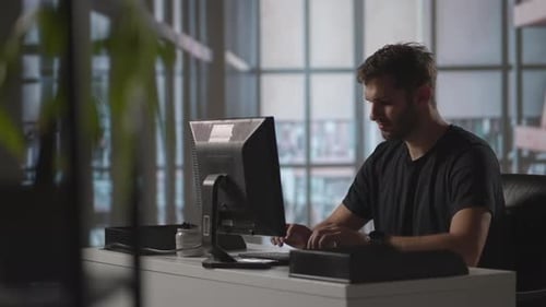 Businessman Working on Computer at Home Office