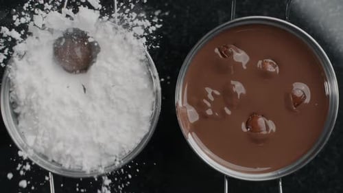 Dipping Chocolate Sweet into White Powder Food