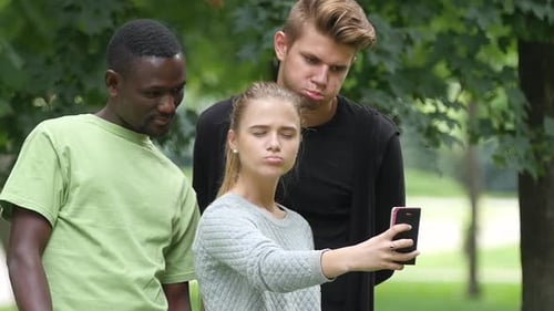 Happy Friends Taking a Selfie on a Blue Sky in Campus Lawn, African Man. Slow Motion