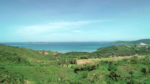 Aerial Drone Flight Over Mountains Covered with Tropical Forest on Sunny Day
