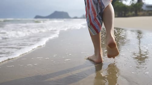 4K Portrait of Beautiful Caucasian woman walking on tropical beach in summer sunny day