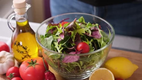 Close Up of Tomatoes Added to Salad