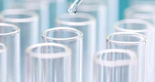 Liquid Being Added to Test Tube with Pipette