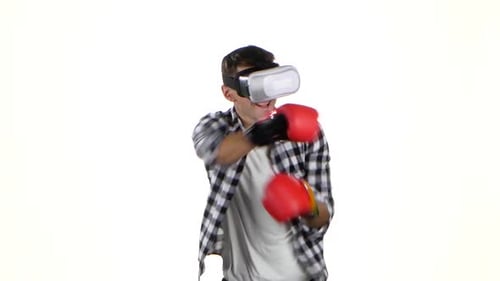 Man Boxing with VR Headset and Boxing Gloves
