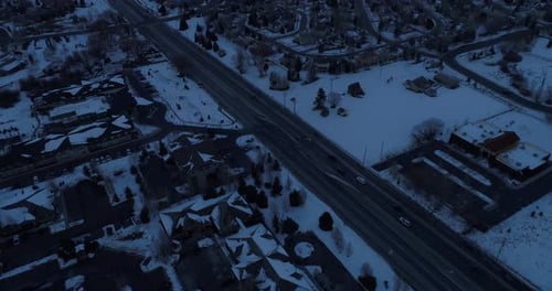 Aerial Slow move forward and pan up to reveal mountain range of park city.