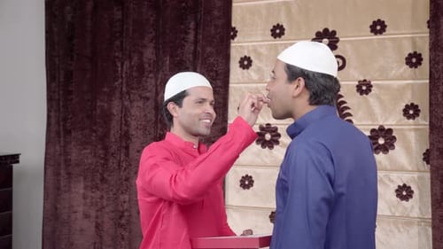 Indian man giving gift on Eid