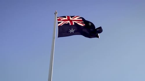 Australian National Flag Waving Against Blue Sky