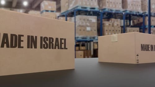 Boxes with MADE IN ISRAEL Text on Conveyor
