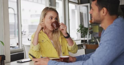 Caucasian couple enjoying at coffee shop
