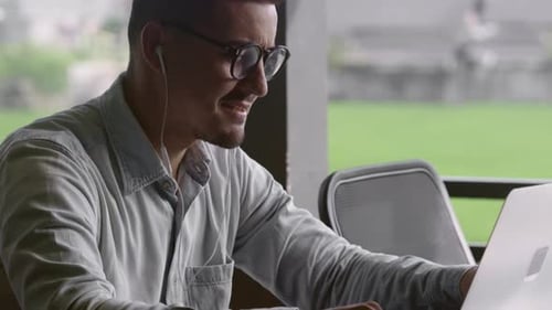 Adult Using Laptop Talking During a Video Conference