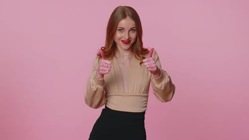 Woman Smiles and Gives a Thumbs Up