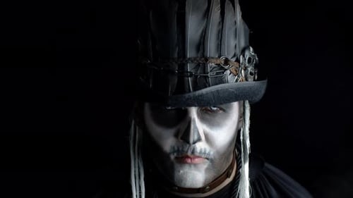 Creepy Man with Skeleton Makeup Appearing From Darkness When Light Falls on Him, Making Faces