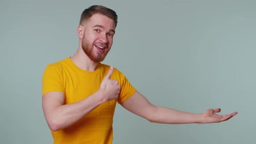 Man Pointing Empty Place Advertising Area for Commercial Text Copy Space for Goods Promotion