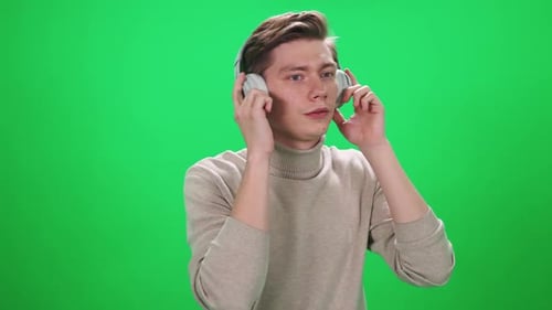 Young Adult Listening to Music with Headphones