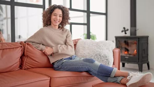 Woman Relaxing on Couch in Cozy Living Room