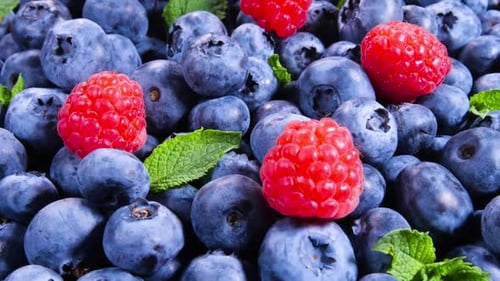 Vibrant Berries with Fresh Mint Leaves Close Up