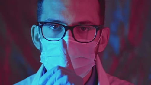 Close Up of Person in Mask and Lab Coat