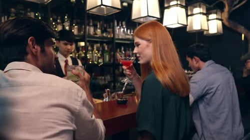 4K Group of People enjoy hangout nightlife at luxury bar.