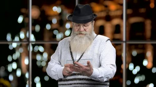 Old Man Using Futuristic Tablet Pc