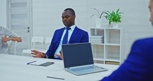 Business Meeting with Man in Suit Speaking