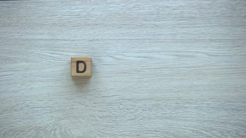 Wooden Blocks Spelling Dream on Gray Surface