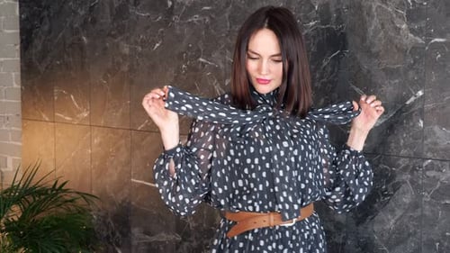 Stylish Woman Posing in Polka Dot Dress