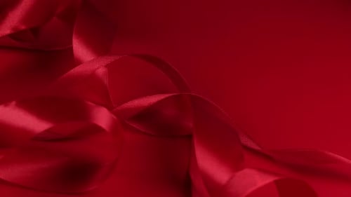 Abstract Flowing Red Satin Ribbon Texture