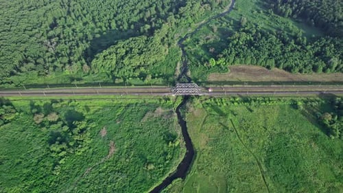 Railway Bridge in Countryside Passing Above Small River