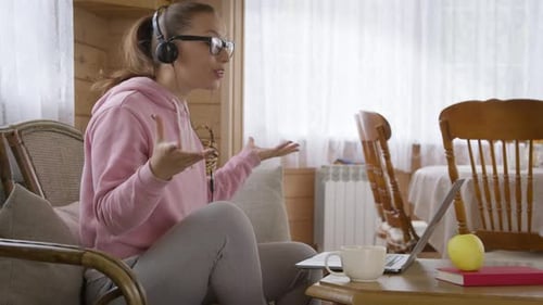 Woman Holds Workshop From Home and Communicates with Colleagues Per Internet.