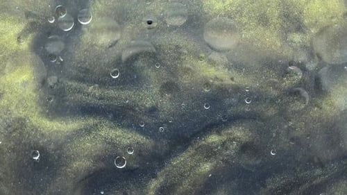 Abstract Swirling Gold and Dark Fluid Texture