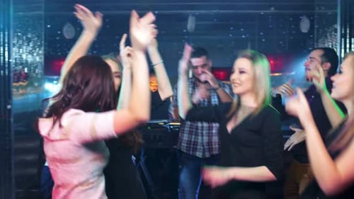 Friends Dancing and Celebrating in a Nightclub