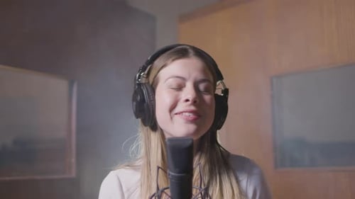 Beautiful Female Singer Working in Music Studio