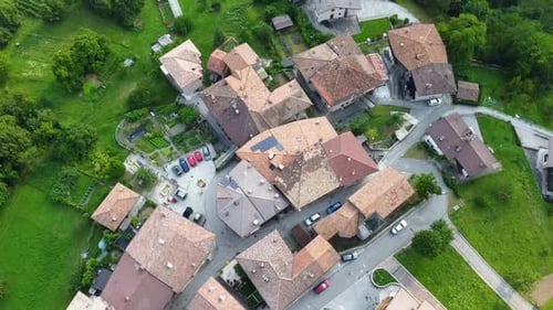 Aerial top down view of a small historic town in the Italian Alps