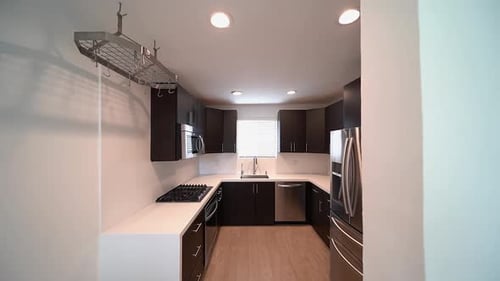 Modern Kitchen Interior with Dark Cabinets and Appliances