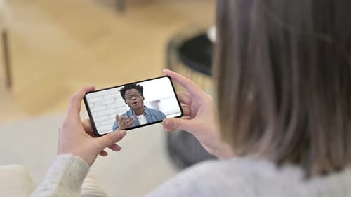 Person Video Chatting on Smartphone with Friend