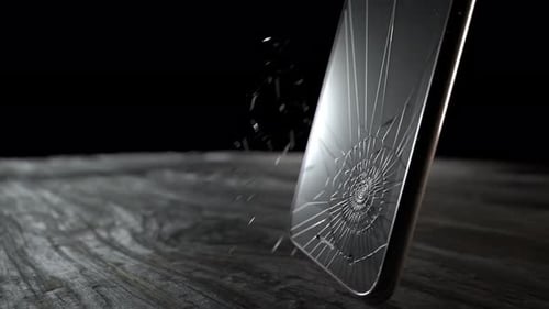 Realistic Smartphone Screen Shattering Animation on Wooden Table