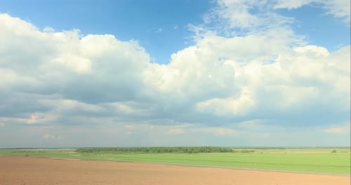Clouds Over the Fields of Farmers Summer Landscape Timelapse