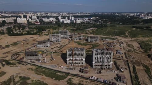 Construction site for a new city block. Construction work is underway.