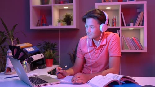 Teen Studies at Desk with Laptop and Books