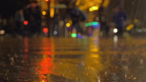 Rain pouring in night city