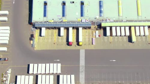 Aerial view of goods warehouse. Logistics center in industrial city zone from above. Aerial view of