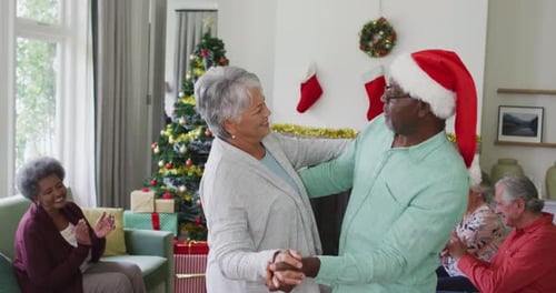 Senior Couple Dancing at Christmas Party