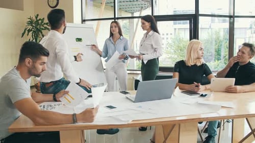 Business Team Working with Papers at Office