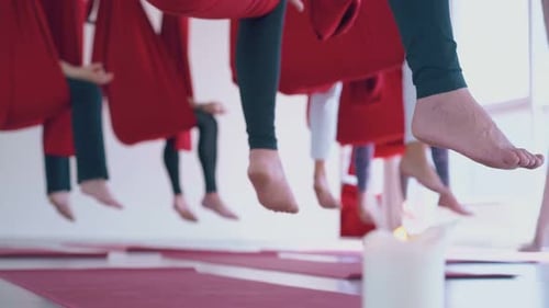 Ladies with Bare Feet Practice Butterfly Fly Yoga Pose