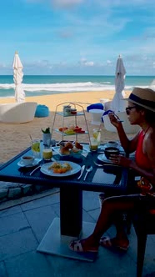 Breakfast on the Beach in Thailand a Luxury Breakfast Table with Food and Beautiful Tropical Sea