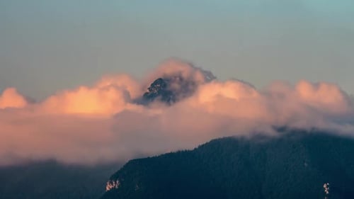 Mystic Clouds in Alpine Mountains Peak